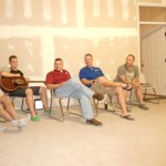 Ryan is in the blue shirt! Jeremy has the guitar, Rob is in the red shirt and Jim on the end in the geen-ish shirt! These are great men of God!